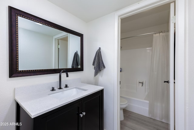 full bathroom featuring toilet, vanity, shower / tub combo with curtain, and hardwood / wood-style flooring