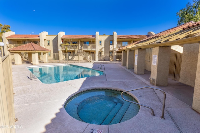 view of pool featuring a gazebo, a hot tub, and a patio