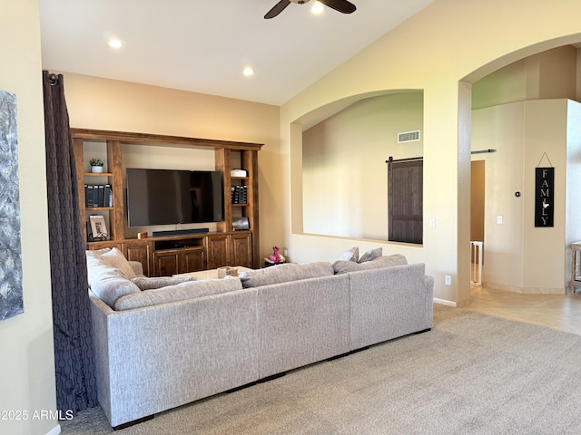 carpeted living area featuring vaulted ceiling, a ceiling fan, visible vents, and recessed lighting