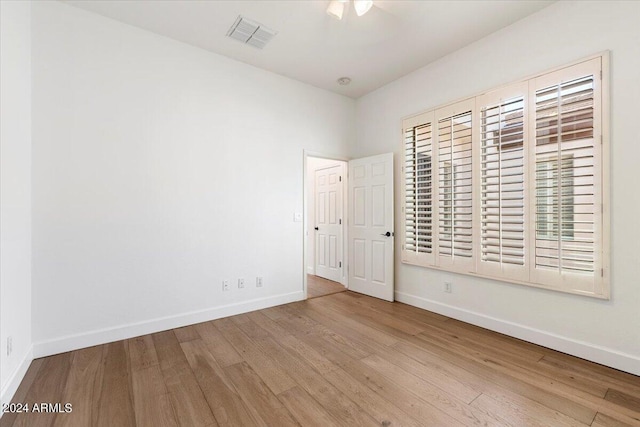 unfurnished bedroom featuring ceiling fan and light hardwood / wood-style floors