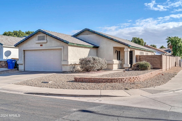 ranch-style home with a garage