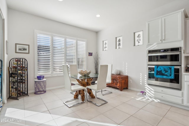 dining area featuring light tile patterned floors