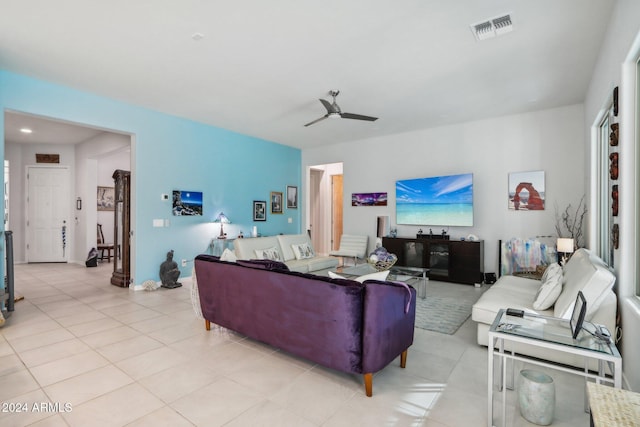 tiled living room featuring ceiling fan