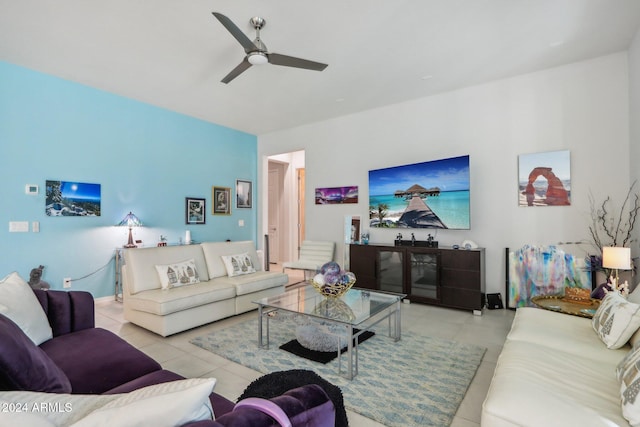 tiled living room featuring ceiling fan