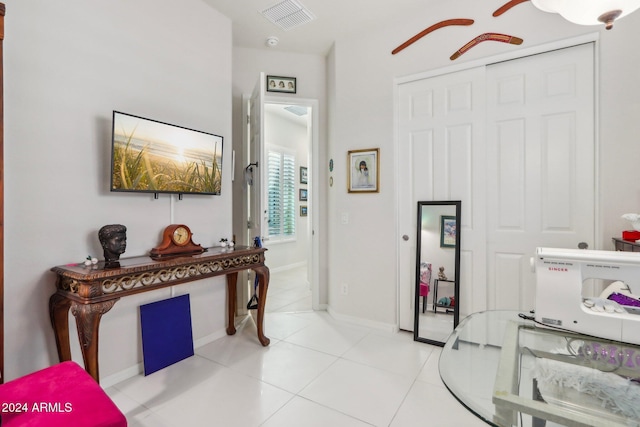 hallway featuring light tile patterned flooring