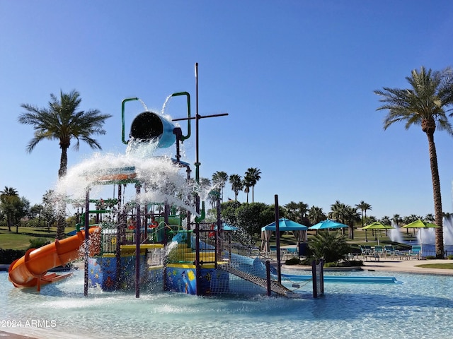 view of jungle gym featuring pool water feature