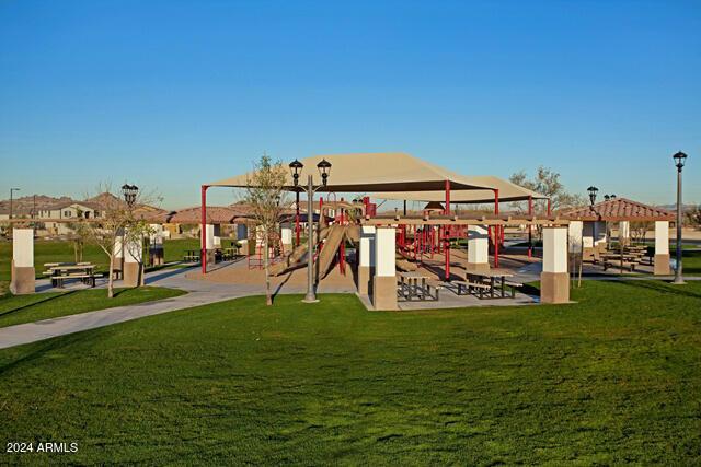 view of play area featuring a lawn