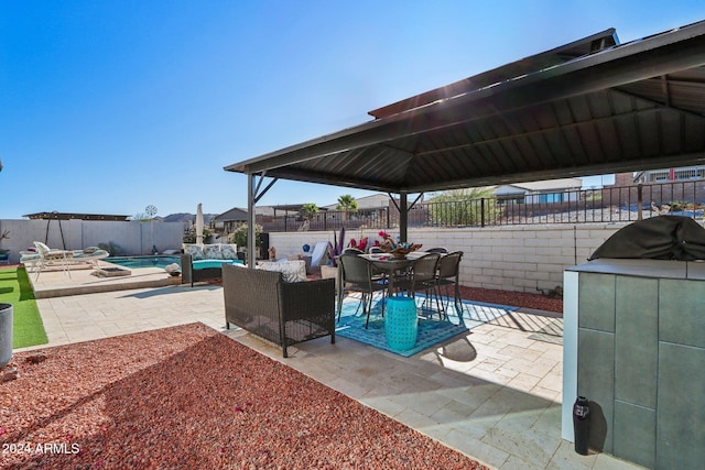 view of patio / terrace with a fenced in pool