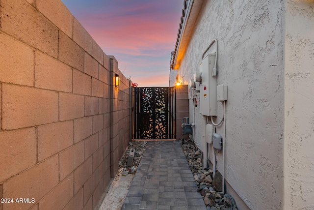 view of gate at dusk