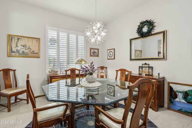 dining area with light tile patterned flooring and an inviting chandelier