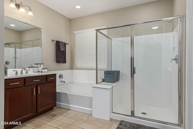 bathroom featuring independent shower and bath and vanity