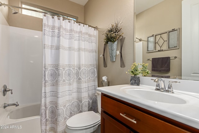 full bathroom with shower / bath combo, vanity, and toilet