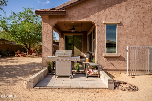 view of patio with ceiling fan and a grill