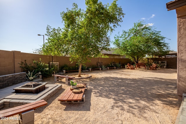 view of patio featuring an outdoor fire pit