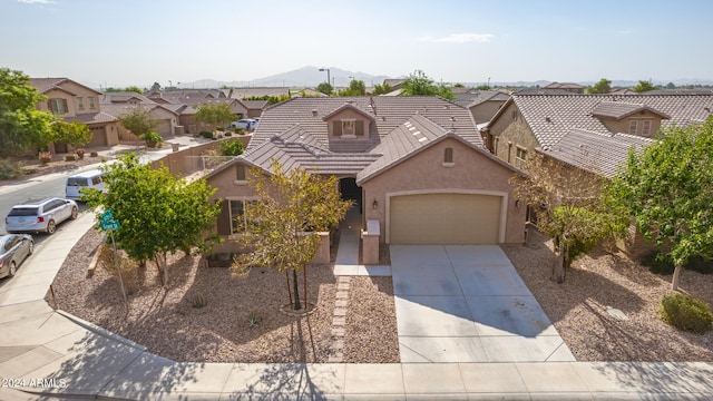 view of front of home featuring a mountain view and a garage