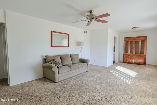 unfurnished living room with carpet floors and ceiling fan