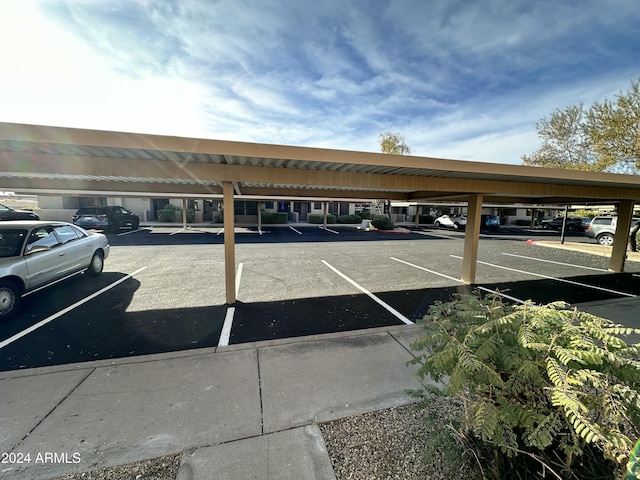 view of vehicle parking featuring a carport