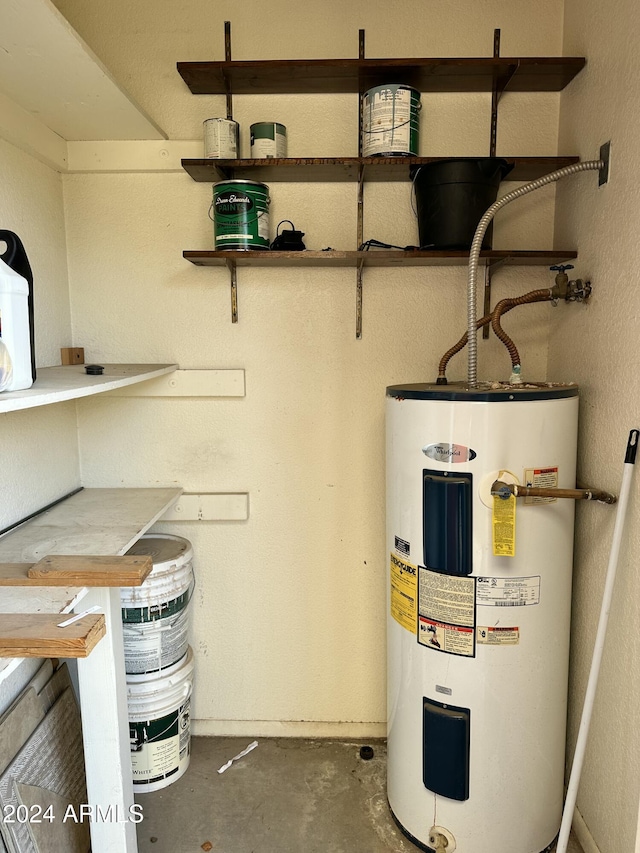 utility room featuring electric water heater