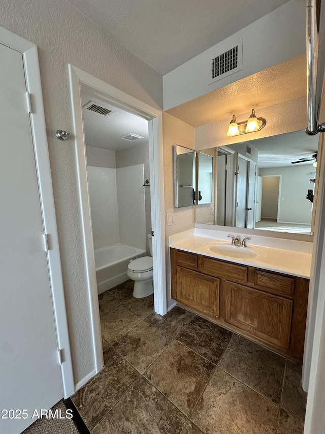 full bathroom with vanity, toilet, and tub / shower combination