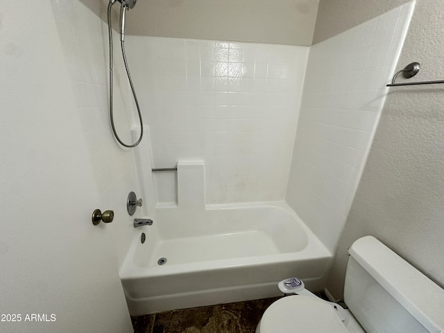 bathroom with shower / washtub combination and toilet