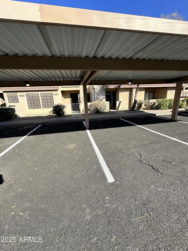 view of car parking featuring a carport