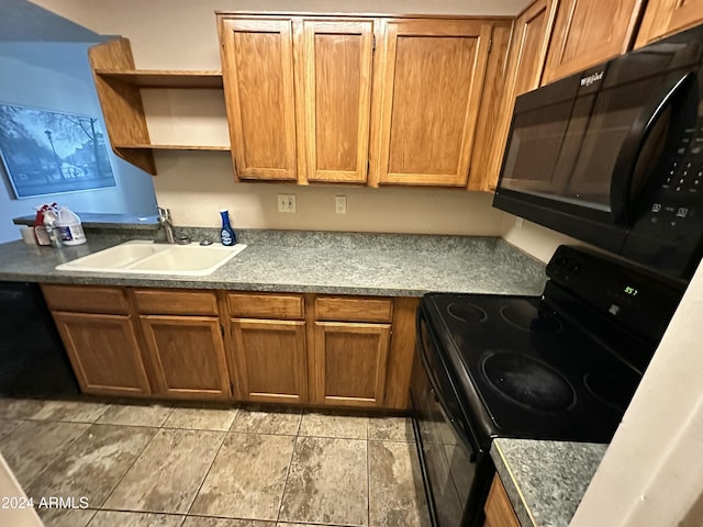 kitchen featuring sink and black appliances