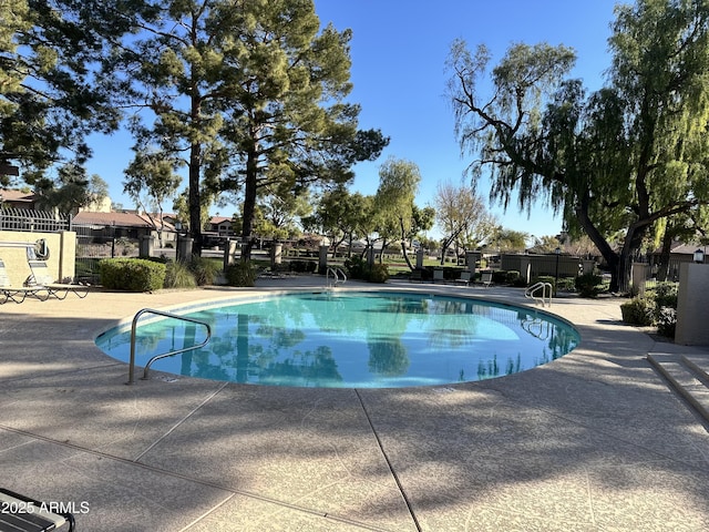 view of pool featuring a patio