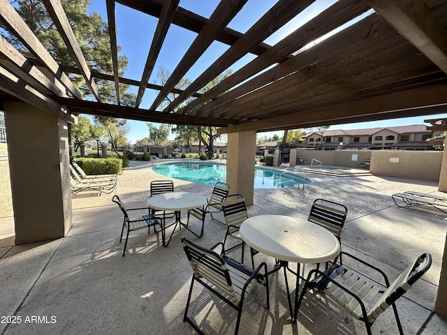 view of swimming pool with a patio area and a pergola