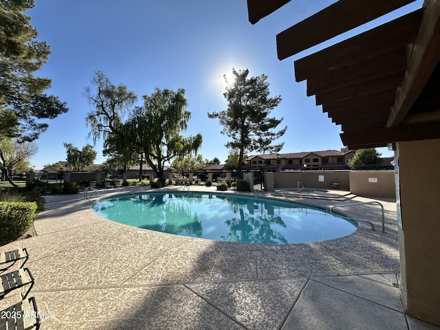 view of swimming pool with a patio