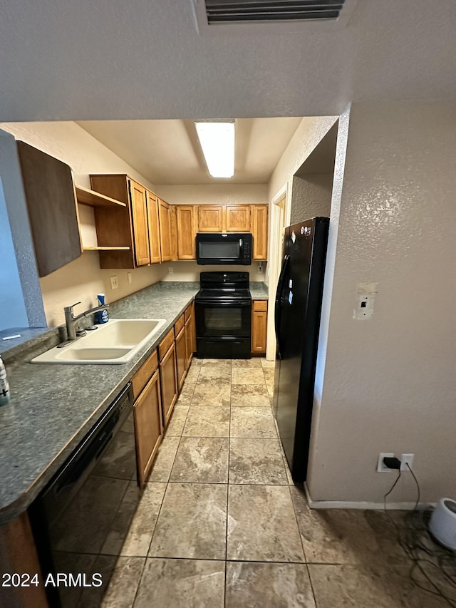 kitchen featuring sink and black appliances