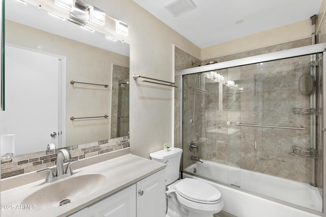 4901 E Kelton Ln Unit 1052, Scottsdale, AZ 85254 - bathroom featuring tasteful backsplash, toilet, enclosed tub / shower combo, and vanity