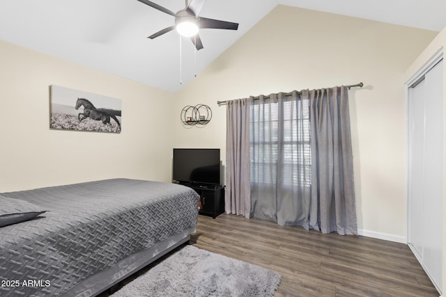 4901 E Kelton Ln Unit 1052, Scottsdale, AZ 85254 - bedroom with wood finished floors, baseboards, high vaulted ceiling, and a ceiling fan