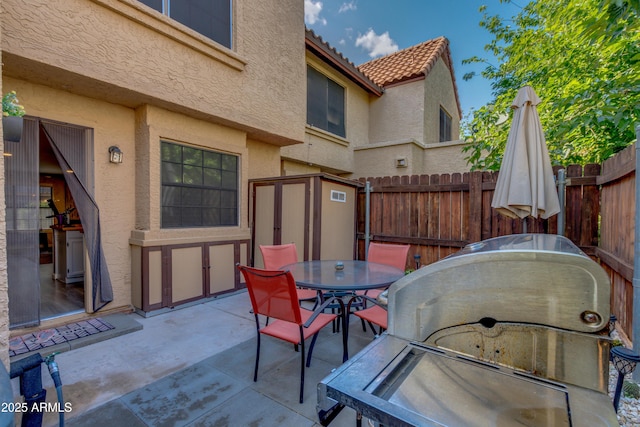 4901 E Kelton Ln Unit 1052, Scottsdale, AZ 85254 - view of patio / terrace with outdoor dining space and fence