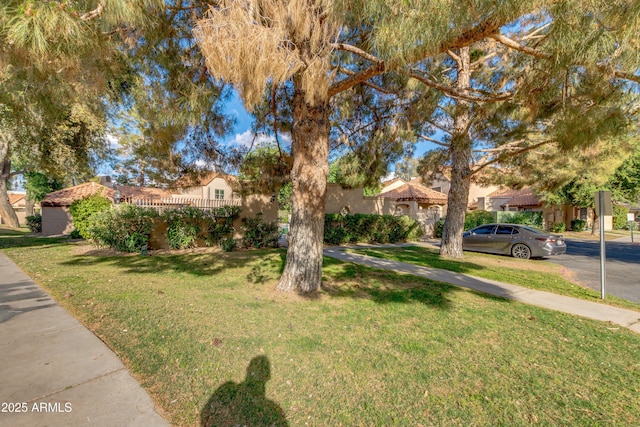 4901 E Kelton Ln Unit 1052, Scottsdale, AZ 85254 - view of front of house featuring a front yard, a residential view, and stucco siding