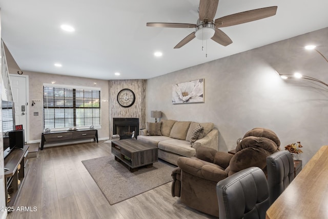 4901 E Kelton Ln Unit 1052, Scottsdale, AZ 85254 - living room with a ceiling fan, wood finished floors, a fireplace, recessed lighting, and baseboards