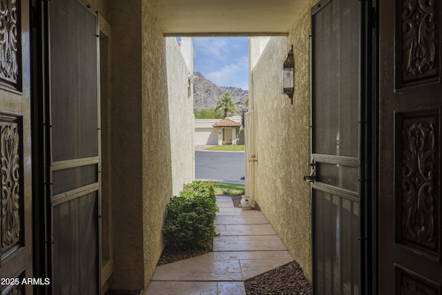 7714 N 17th Pl, Phoenix, AZ 85020 - doorway to outside featuring a mountain view and stone tile flooring