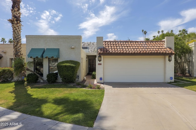 7714 N 17th Pl, Phoenix, AZ 85020 - view of front of home featuring stucco siding, an attached garage, driveway, and a front yard