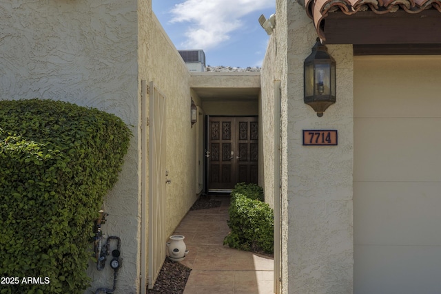 7714 N 17th Pl, Phoenix, AZ 85020 - entrance to property featuring central AC unit and stucco siding