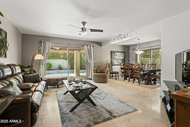 7714 N 17th Pl, Phoenix, AZ 85020 - tiled living area with ceiling fan