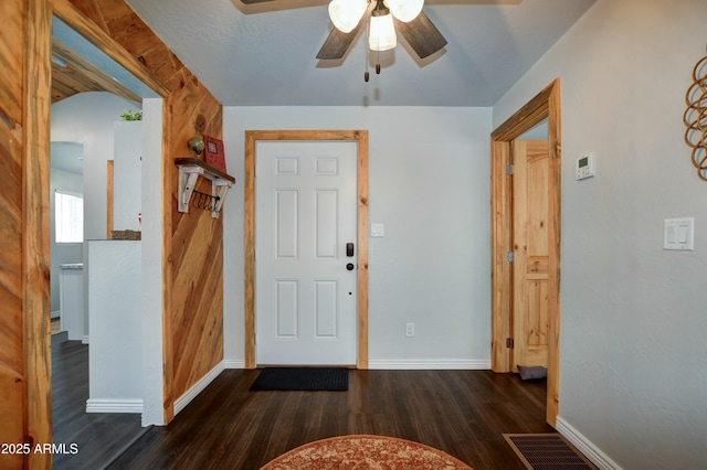 foyer with dark wood-type flooring and ceiling fan