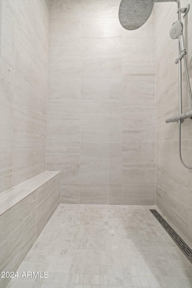 bathroom with tiled shower