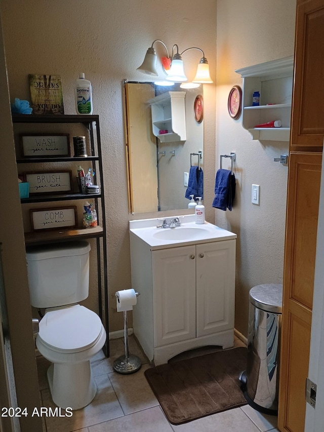 bathroom with tile patterned floors, vanity, and toilet