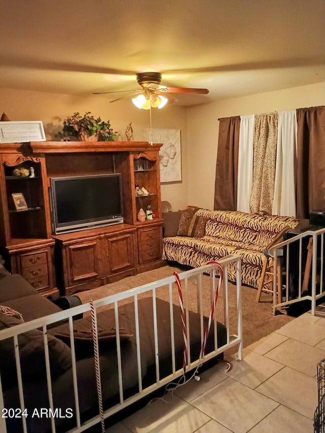 tiled living room featuring ceiling fan