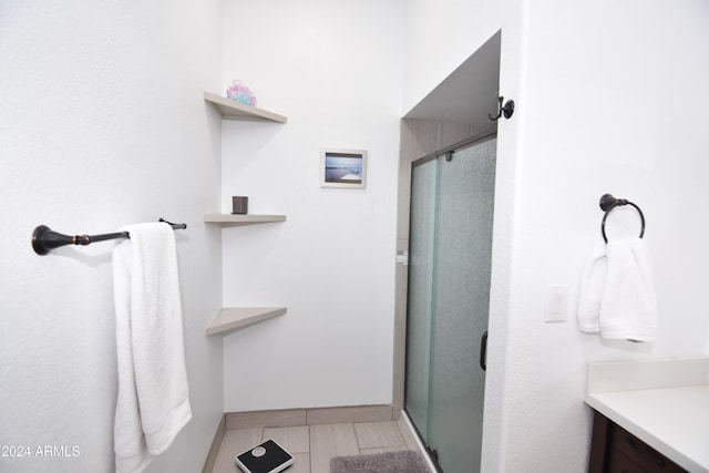 bathroom with vanity and an enclosed shower