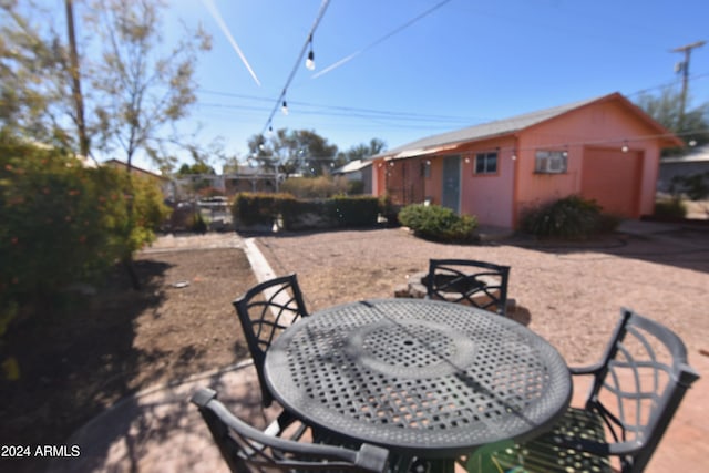 view of patio with an outbuilding