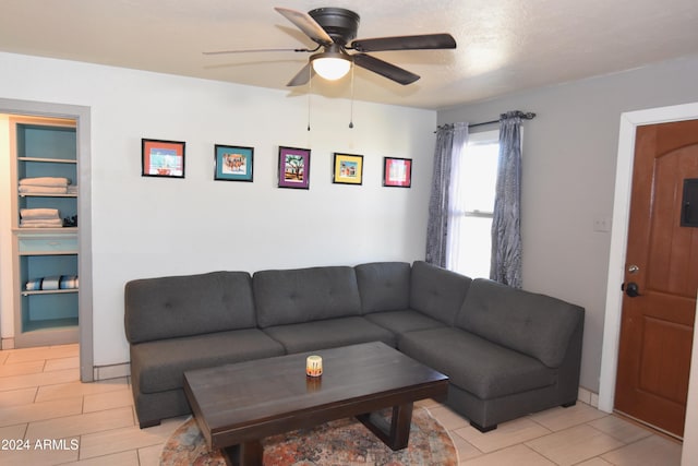 living room featuring electric panel and ceiling fan