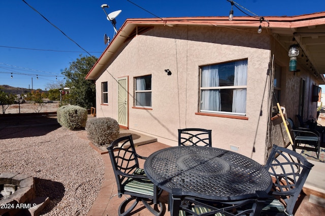 back of property with a patio