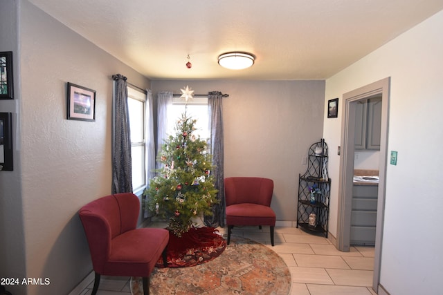 living area with light tile patterned floors