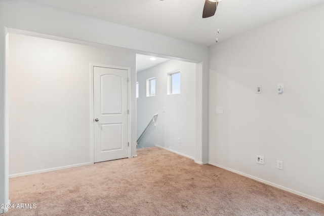 spare room with carpet flooring and ceiling fan