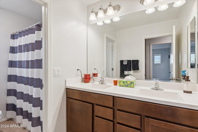 bathroom with tile patterned flooring, vanity, and a shower with shower curtain